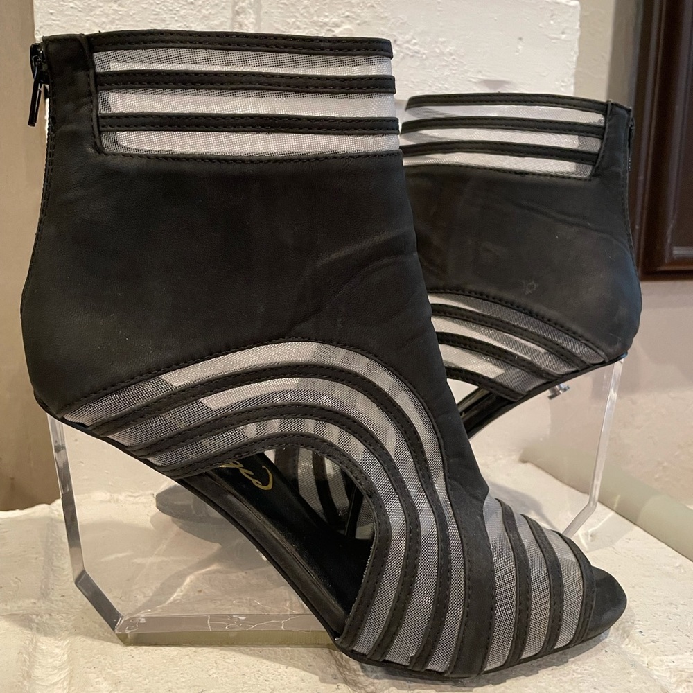 Privileged Black Wedge Shoes with Unique Design